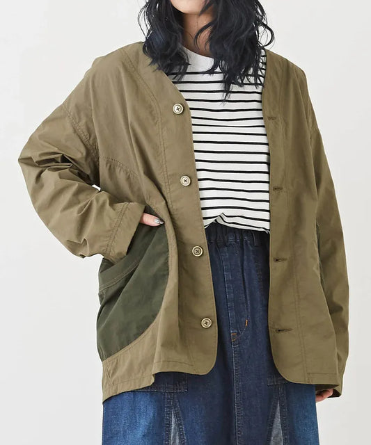 Japanese-style workwear with color blocking and large pockets, lightweight jacket.