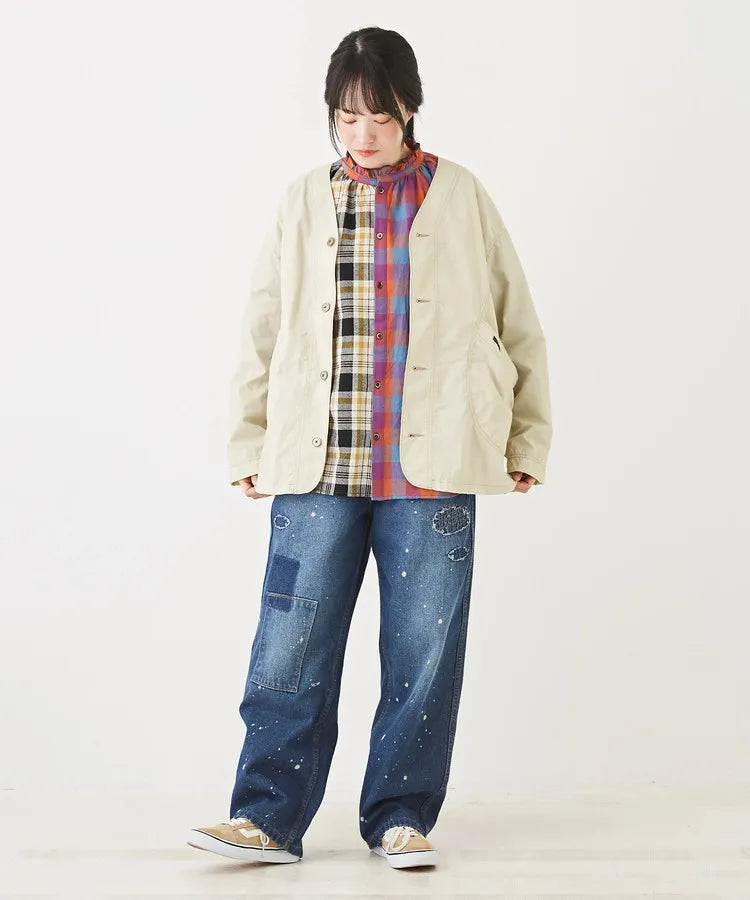 Japanese-style workwear with color blocking and large pockets, lightweight jacket.