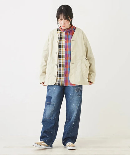 Japanese-style workwear with color blocking and large pockets, lightweight jacket.