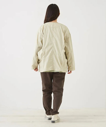 Japanese-style workwear with color blocking and large pockets, lightweight jacket.