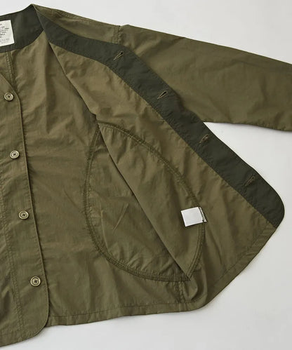 Japanese-style workwear with color blocking and large pockets, lightweight jacket.