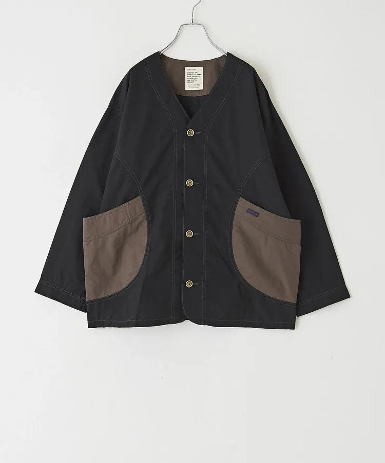 Japanese-style workwear with color blocking and large pockets, lightweight jacket.