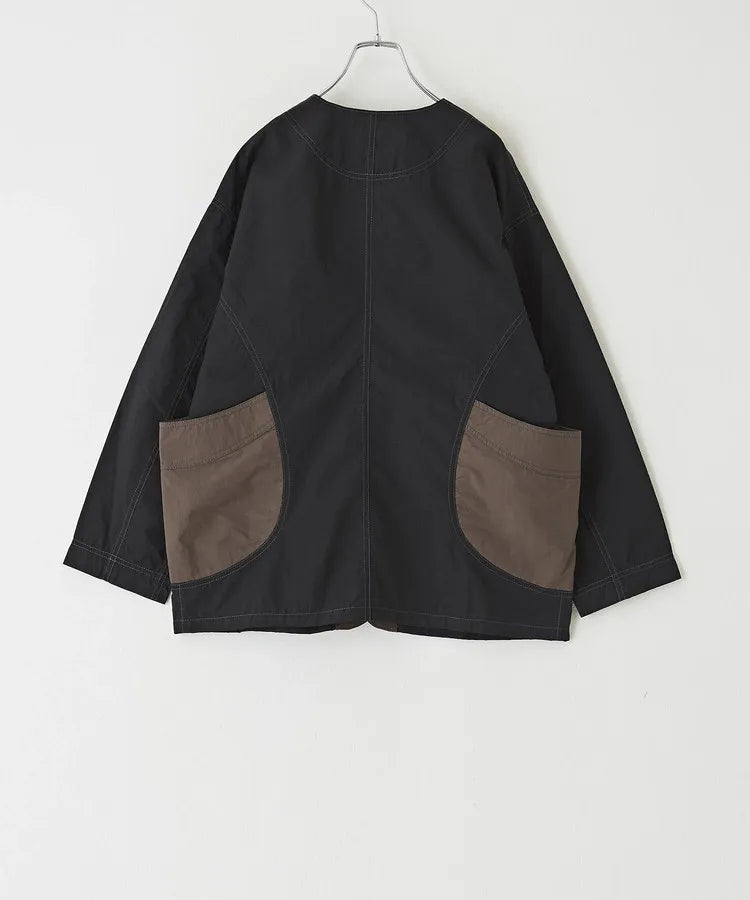 Japanese-style workwear with color blocking and large pockets, lightweight jacket.