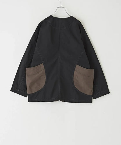 Japanese-style workwear with color blocking and large pockets, lightweight jacket.