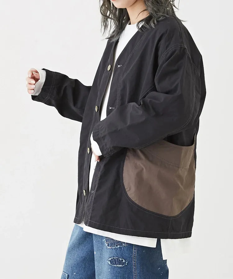 Japanese-style workwear with color blocking and large pockets, lightweight jacket.