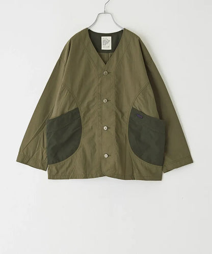 Japanese-style workwear with color blocking and large pockets, lightweight jacket.