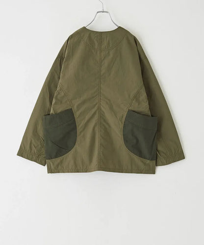 Japanese-style workwear with color blocking and large pockets, lightweight jacket.