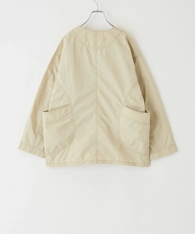 Japanese-style workwear with color blocking and large pockets, lightweight jacket.